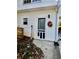 Exterior of home featuring backdoor with wreath, siding, and small window at 321 Bouldercrest Way, Woodstock, GA 30188