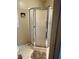 This bathroom features a shower with frosted glass door, toilet and decor at 321 Bouldercrest Way, Woodstock, GA 30188