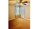 Neutral bedroom with ceiling fan, carpeted floor and natural light through the decorative curtains at 321 Bouldercrest Way, Woodstock, GA 30188