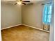 This bedroom is carpeted and features one window at 321 Bouldercrest Way, Woodstock, GA 30188