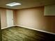 Unfurnished room with wood-look vinyl flooring and blank walls at 321 Bouldercrest Way, Woodstock, GA 30188