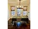 Eat-in dining area with wood floors, bright windows, and chandelier at 321 Bouldercrest Way, Woodstock, GA 30188
