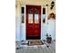 Exterior view of the front door with a 'welcome' mat and decorative accents at 321 Bouldercrest Way, Woodstock, GA 30188