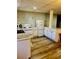 This kitchen features white appliances, wood cabinets and plank floors at 321 Bouldercrest Way, Woodstock, GA 30188