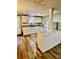 This kitchen features white appliances, wood cabinets and plank floors at 321 Bouldercrest Way, Woodstock, GA 30188