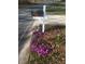Mailbox with flowers planted below along the roadside at 321 Bouldercrest Way, Woodstock, GA 30188