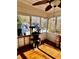 This sunroom is the purr-fect place for your feline friends to survey the property at 321 Bouldercrest Way, Woodstock, GA 30188