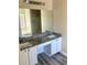 Bathroom with dual sinks, granite counters, and modern cabinetry at 1255 Silverstone Trl, Jonesboro, GA 30238