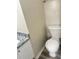 Half bath featuring granite countertop, white cabinet and standard toilet at 1255 Silverstone Trl, Jonesboro, GA 30238