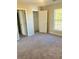 Spacious bedroom with plush carpet, walk in closet, and lots of light at 1255 Silverstone Trl, Jonesboro, GA 30238