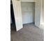 Closet with lots of built in shelving and bars for hanging clothing at 1255 Silverstone Trl, Jonesboro, GA 30238