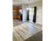 Bright dining area with hardwood floors, open to kitchen with window views at 1255 Silverstone Trl, Jonesboro, GA 30238