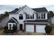 Charming two-story home with a two car garage and lovely architectural features at 1255 Silverstone Trl, Jonesboro, GA 30238