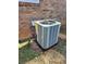 New central AC unit installed against the brick wall at 4129 Pepperdine Dr, Decatur, GA 30034