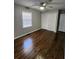 Hardwood floors and a large closet in this well-lit bedroom at 4129 Pepperdine Dr, Decatur, GA 30034