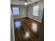 Spacious bedroom with dark hardwood floors and ceiling fan at 4129 Pepperdine Dr, Decatur, GA 30034