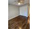 Hardwood floors, ceiling fan and closet in this light bedroom at 4129 Pepperdine Dr, Decatur, GA 30034