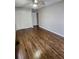 Bright bedroom featuring hardwood floors and built-in closet at 4129 Pepperdine Dr, Decatur, GA 30034