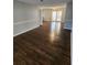Bright dining room with dark hardwood floors and french doors at 4129 Pepperdine Dr, Decatur, GA 30034