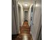 Dark hardwood floors in a hallway with doors to other rooms at 4129 Pepperdine Dr, Decatur, GA 30034