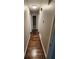Bright hallway with dark hardwood floors leading to bedrooms and bathroom at 4129 Pepperdine Dr, Decatur, GA 30034