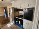 Stainless steel appliances and white cabinetry highlight this updated kitchen at 4129 Pepperdine Dr, Decatur, GA 30034