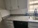 Kitchen features granite countertops and white shaker-style cabinets at 4129 Pepperdine Dr, Decatur, GA 30034
