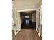 Open living room with dark hardwood floors and French doors at 4129 Pepperdine Dr, Decatur, GA 30034