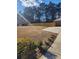 Spacious side yard with a new wooden fence and driveway at 4129 Pepperdine Dr, Decatur, GA 30034
