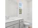 Bathroom featuring a sink, a toilet, a bathtub and a window at 40 Spirea Way, Auburn, GA 30011