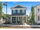 Charming two-story home with blue siding, white trim, and a welcoming yellow front door at 40 Spirea Way, Auburn, GA 30011