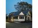 Exterior of a modern farmhouse style home at dusk, complete with an intersecting street at 40 Spirea Way, Auburn, GA 30011