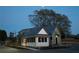 Exterior of the house with modern farmhouse design elements at dusk at 40 Spirea Way, Auburn, GA 30011