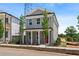 Attractive two-story home with gray siding, white trim, a front porch and a red front door at 40 Spirea Way, Auburn, GA 30011