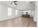 Spacious open-concept living room with wood floors and a modern kitchen island at 40 Spirea Way, Auburn, GA 30011