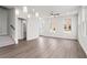 Open-concept living room with hardwood floors, staircase, and plenty of natural light at 40 Spirea Way, Auburn, GA 30011