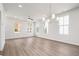 Bright and spacious living room with hardwood floors, recessed lighting, and large windows at 40 Spirea Way, Auburn, GA 30011