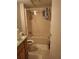Compact bathroom featuring a shower-tub combination and vanity storage at 230 Highland Blvd, Stockbridge, GA 30281
