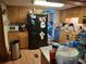 Kitchen with wooden cabinets and black refrigerator offers plenty of storage space at 230 Highland Blvd, Stockbridge, GA 30281