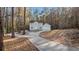 Two-story house with a long driveway surrounded by trees at 1238 Sandy Creek Rd, Fayetteville, GA 30214