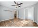 Bedroom with wood floors, ceiling fan, and walk-in closet at 1238 Sandy Creek Rd, Fayetteville, GA 30214