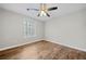 Bedroom with wood floors and a ceiling fan at 1238 Sandy Creek Rd, Fayetteville, GA 30214