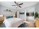 Bedroom with wood floors, ceiling fan, and walk-in closet at 1238 Sandy Creek Rd, Fayetteville, GA 30214