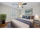 Bedroom with wood floors, ceiling fan, and window at 1238 Sandy Creek Rd, Fayetteville, GA 30214