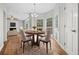 Bright dining area with wood floors and view into living room at 1238 Sandy Creek Rd, Fayetteville, GA 30214