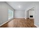 Bright dining room with hardwood floors and fireplace view at 1238 Sandy Creek Rd, Fayetteville, GA 30214