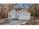 Two-story house, attached garage, wooded lot at 1238 Sandy Creek Rd, Fayetteville, GA 30214