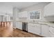 Modern kitchen featuring white cabinets and granite countertops at 1238 Sandy Creek Rd, Fayetteville, GA 30214