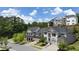 Aerial view of houses on a tree-lined street at 1005 Coleman Place Dr, Roswell, GA 30075