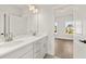 Clean bathroom with double vanity and a view into bedroom at 1005 Coleman Place Dr, Roswell, GA 30075